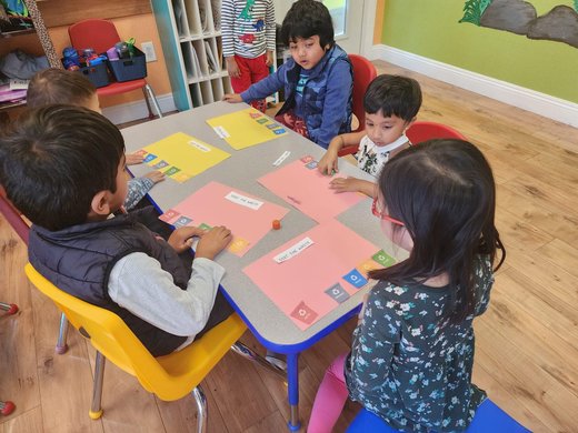 Children engaged in a learning activity at Level Up Montessori classroom.