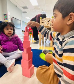 Children engaged in Montessori block activity at Level Up Montessori.