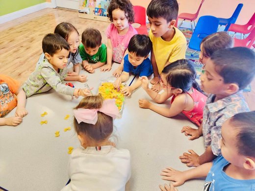 Toddlers engaging in hands-on learning at Level Up Montessori, building confidence through play and routines.