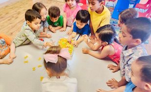 Toddlers engaging in hands-on learning at Level Up Montessori, building confidence through play and routines.