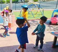 Children playing outside in Level Up Montessori's after-school program for kindergartners.