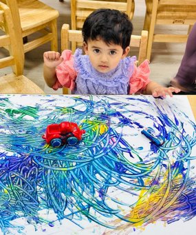 Kindergartner at Level Up Montessori engaging in art activity with colorful drawings and toy cars.