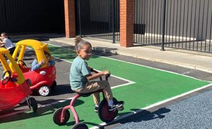 Children playing outside during Level Up Montessori after-school program.
