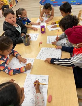 Children engaged in learning activities at Level Up Montessori classroom.