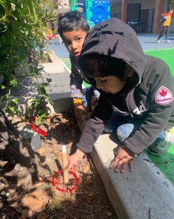 Children playing outdoors in the Level Up Montessori after-school program.