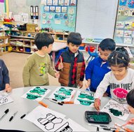 Children engaging in arts and crafts at a Montessori school.