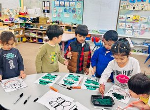 Children engaging in arts and crafts at a Montessori school.