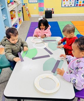 Toddlers engaging in hands-on creative activities at Level Up Montessori to build confidence and early skills.