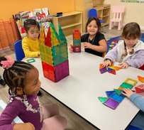 Children engage in hands-on learning and building activities at Level Up Montessori preschool classroom.