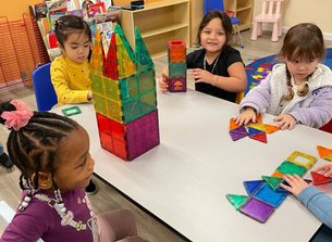 Children engage in hands-on learning and building activities at Level Up Montessori preschool classroom.