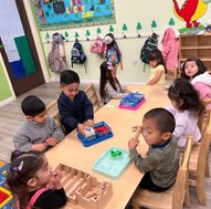 Children engaged in educational activities at Level Up Montessori Bay Area classroom.
