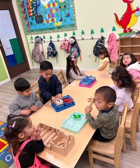 Children engaged in educational activities at Level Up Montessori Bay Area classroom.