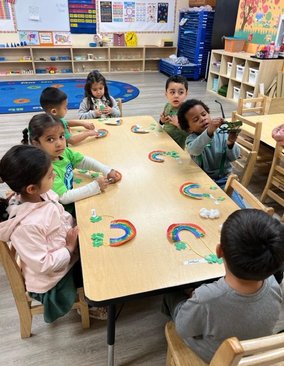 Toddlers engaging in a hands-on learning activity at Level Up Montessori, building confidence and early skills.