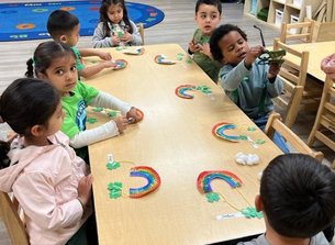 Toddlers engaging in a hands-on learning activity at Level Up Montessori, building confidence and early skills.