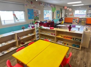 Bright Montessori classroom setup at Level Up Montessori in the Bay Area, showcasing learning materials and child-friendly furniture.