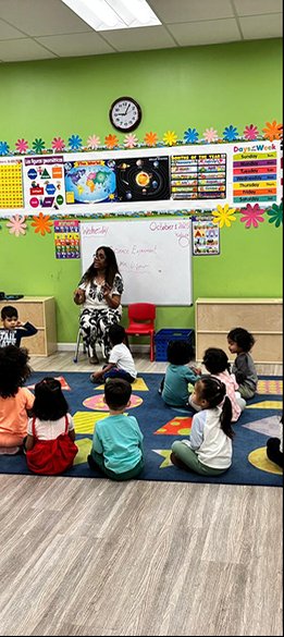 Montessori class with children seated in a circle in Bay Area program for ages 12 months to 6 years.
