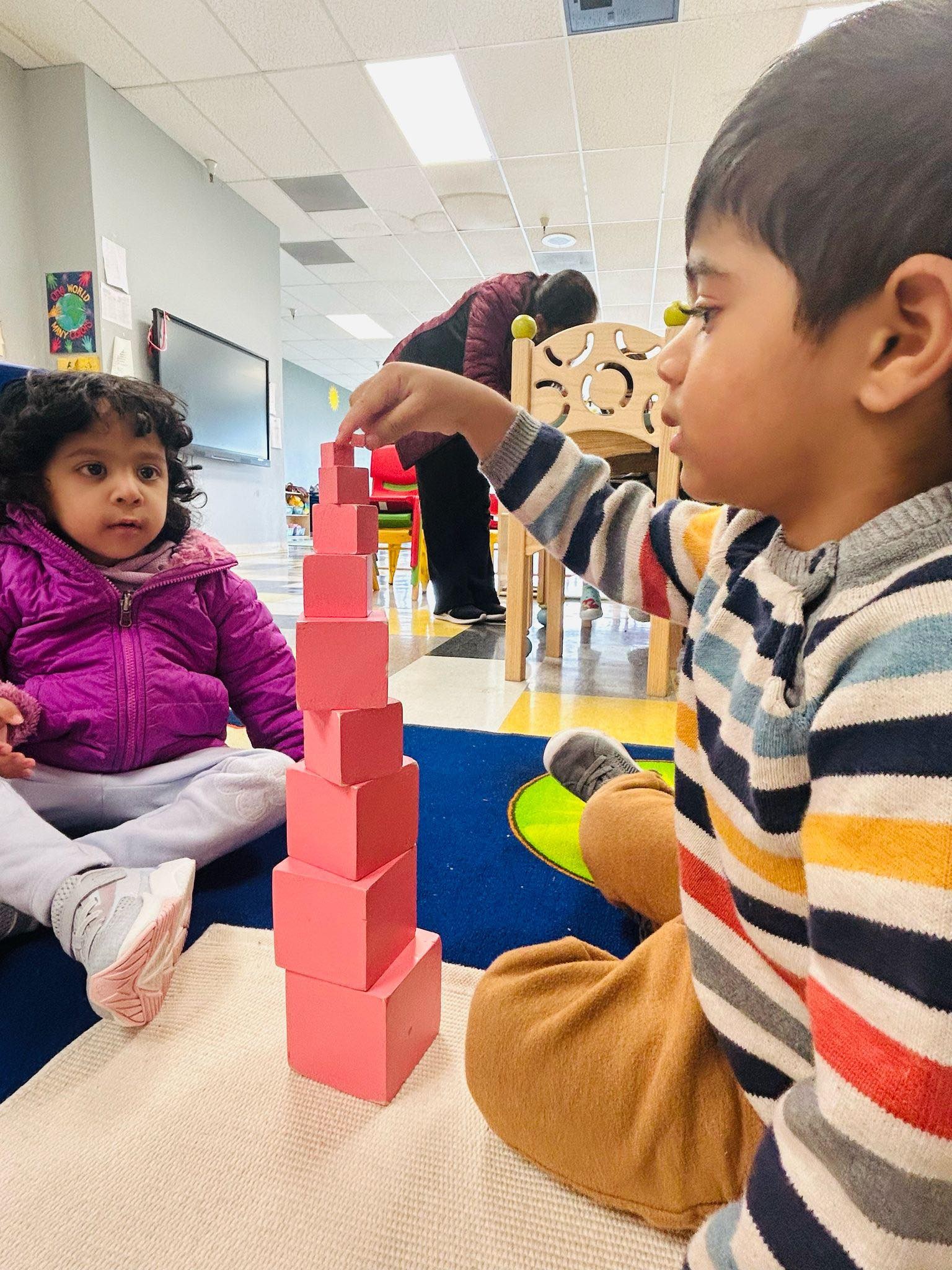 Children engaged in Montessori block activity at Level Up Montessori.