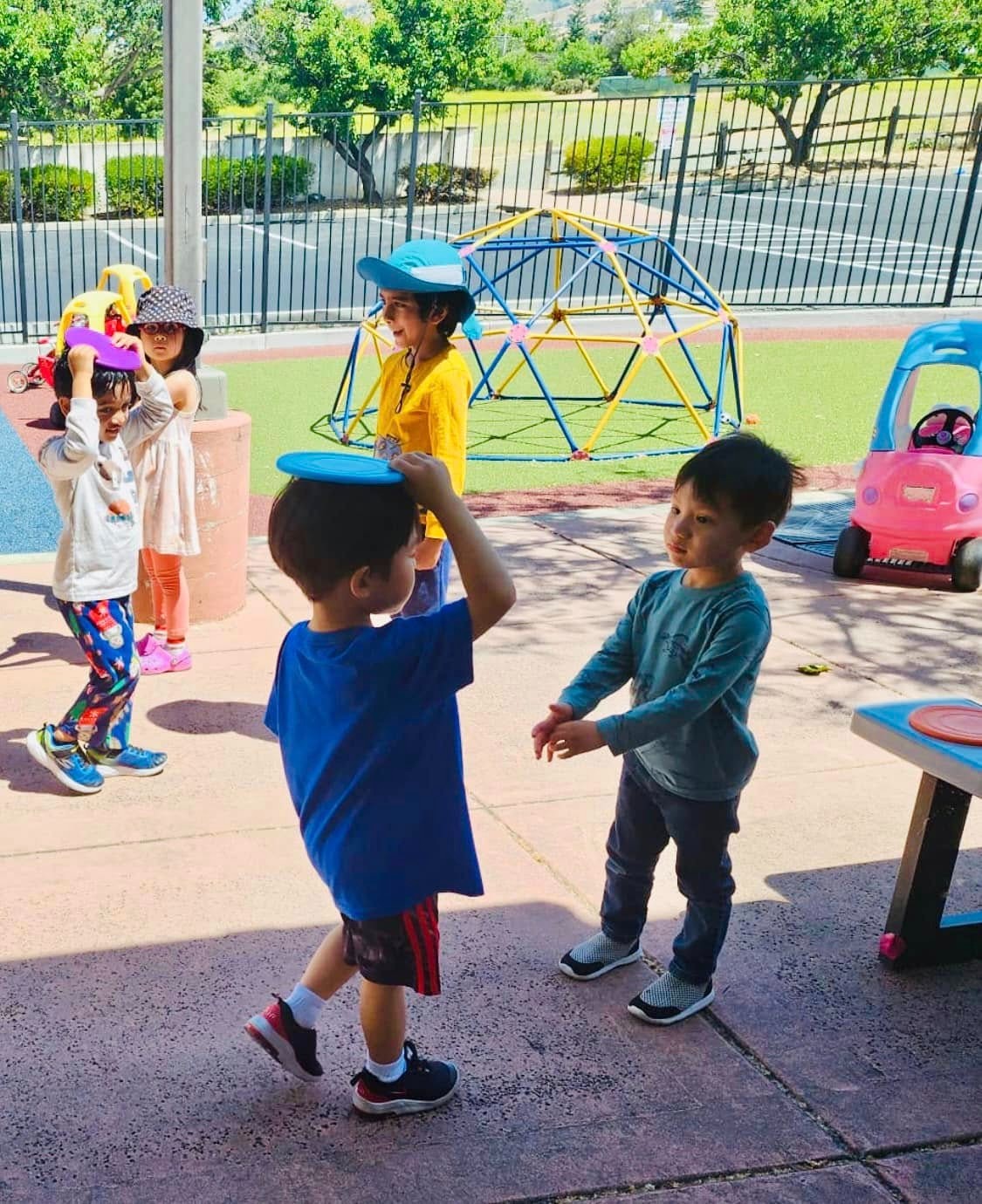 Children playing outside in Level Up Montessori's after-school program for kindergartners.