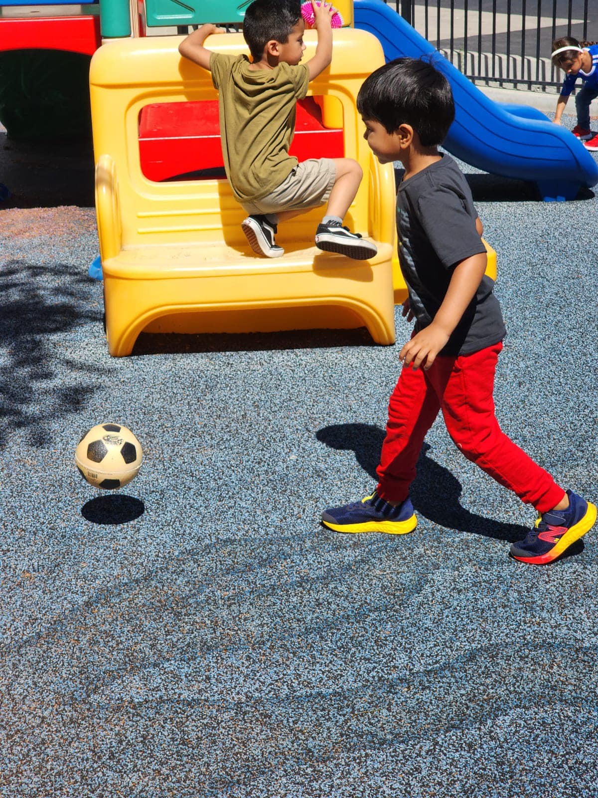 Children playing outside at Level Up Montessori after-school program.
