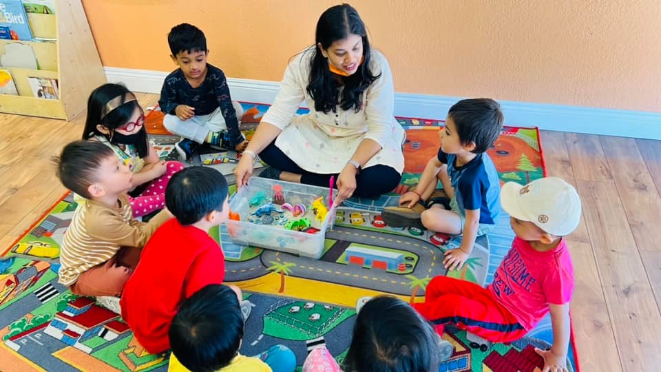 Children engaged in hands-on activity at Level Up Montessori preschool program.
